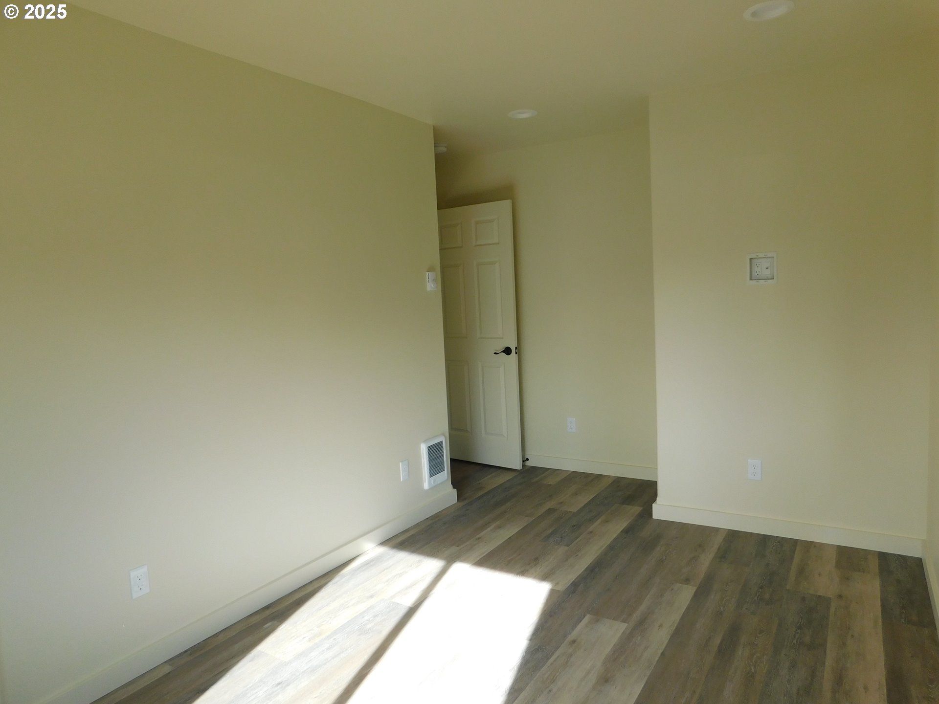 130 East Date Street Powers, OR 97466 - Photo 26 of 29 a view of a room with wooden floor and a white wall