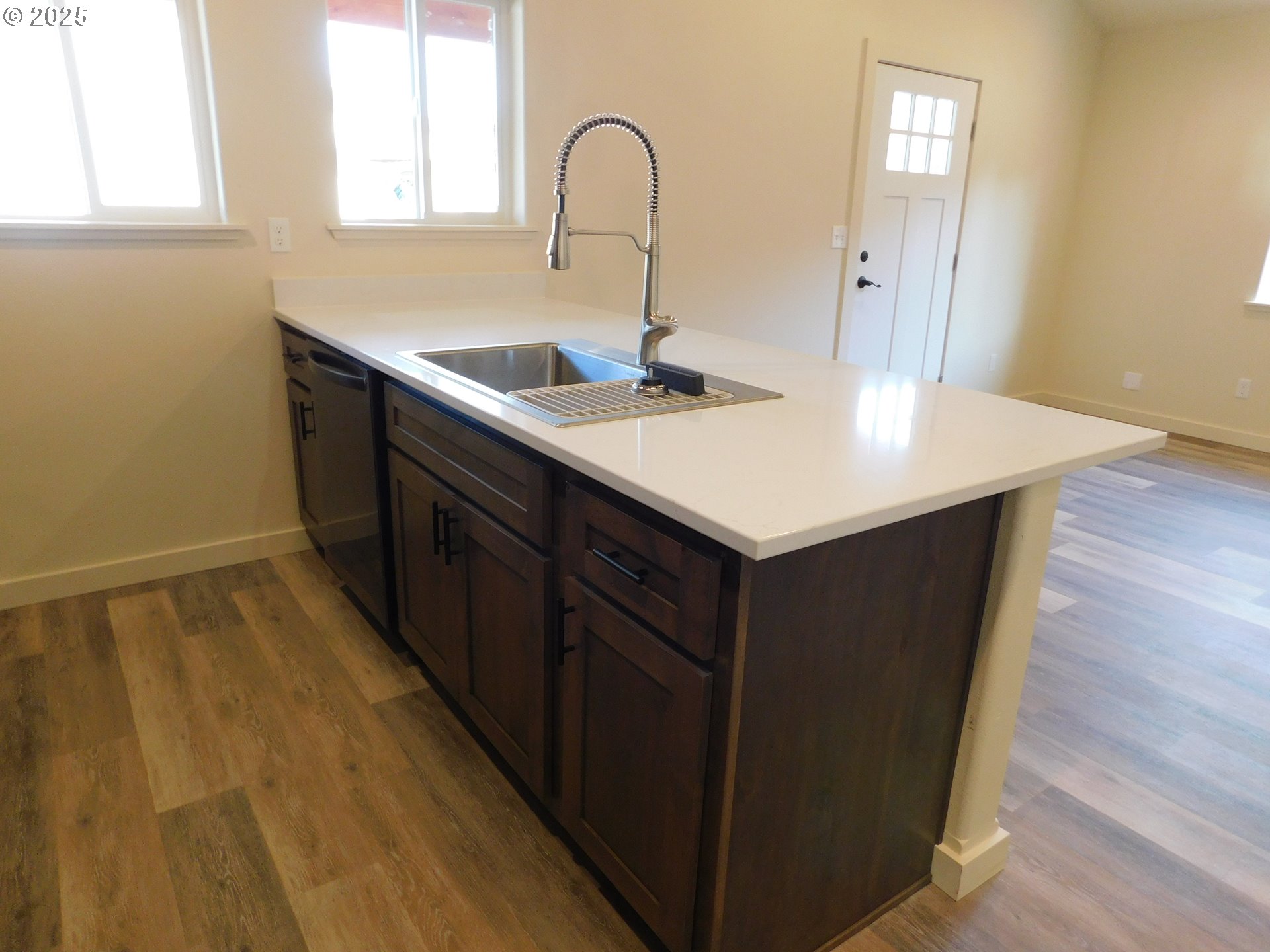 130 East Date Street Powers, OR 97466 - Photo 10 of 29 a kitchen with a sink a counter space and a window