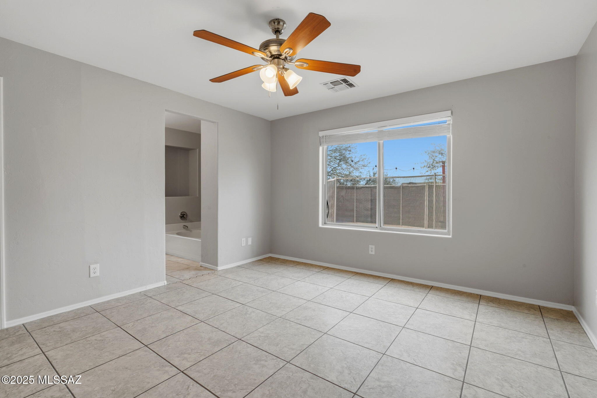8244 South Lost Mountain Road Tucson, AZ 85747 - Photo 17 of 41 a view of an empty room with a window