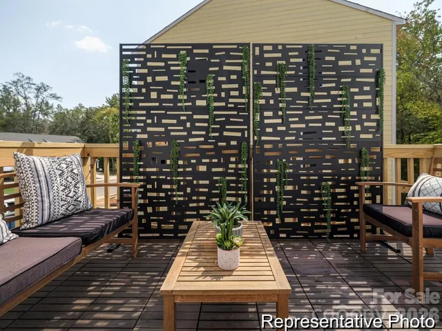 a view of a balcony with wooden floor