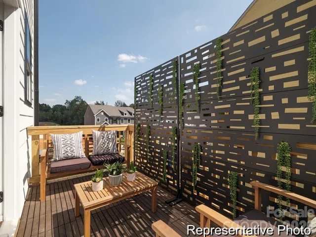 a view of balcony with wooden floor