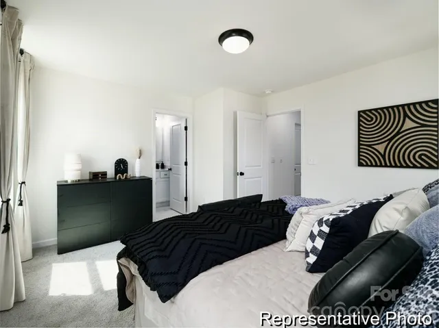 a bedroom with a bed and a mirror