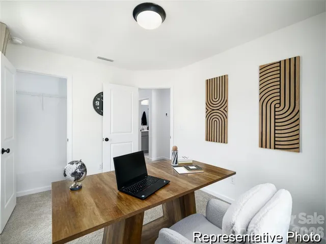 a view of a workspace with furniture