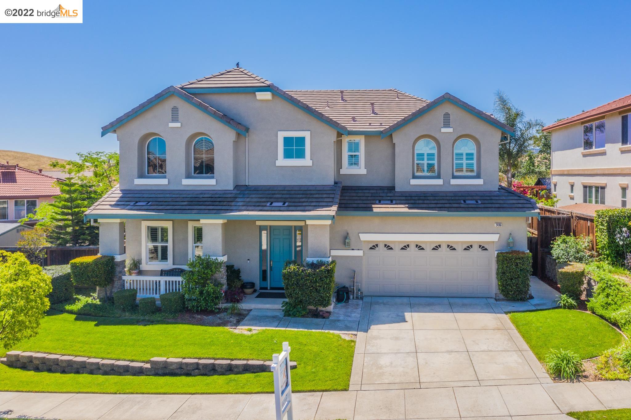 2496 Winged Foot Road Brentwood, CA 94513 - Photo 1 of 1 a front view of a house with a yard and garage