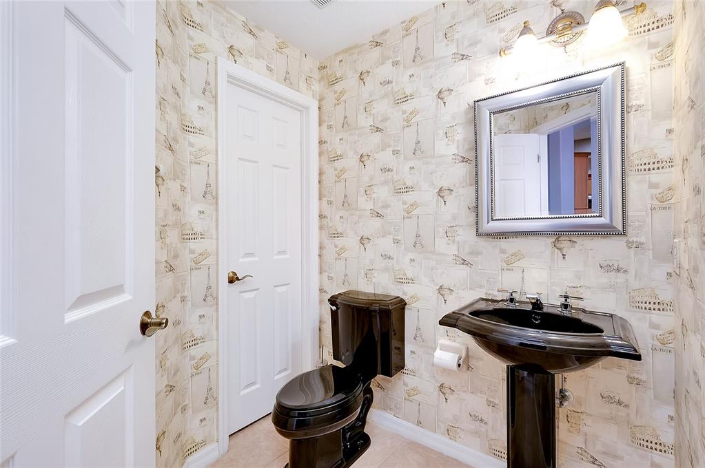 3975 Square E Lane, Unit 9 Sarasota, FL 34238 - Photo 14 of 52 a bathroom with a sink and a toilet