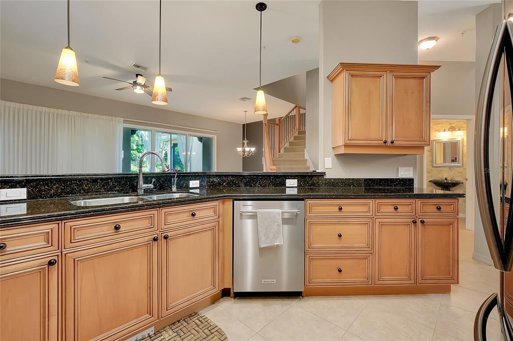 3975 Square E Lane, Unit 9 Sarasota, FL 34238 - Photo 20 of 52 a kitchen with white cabinets and sink