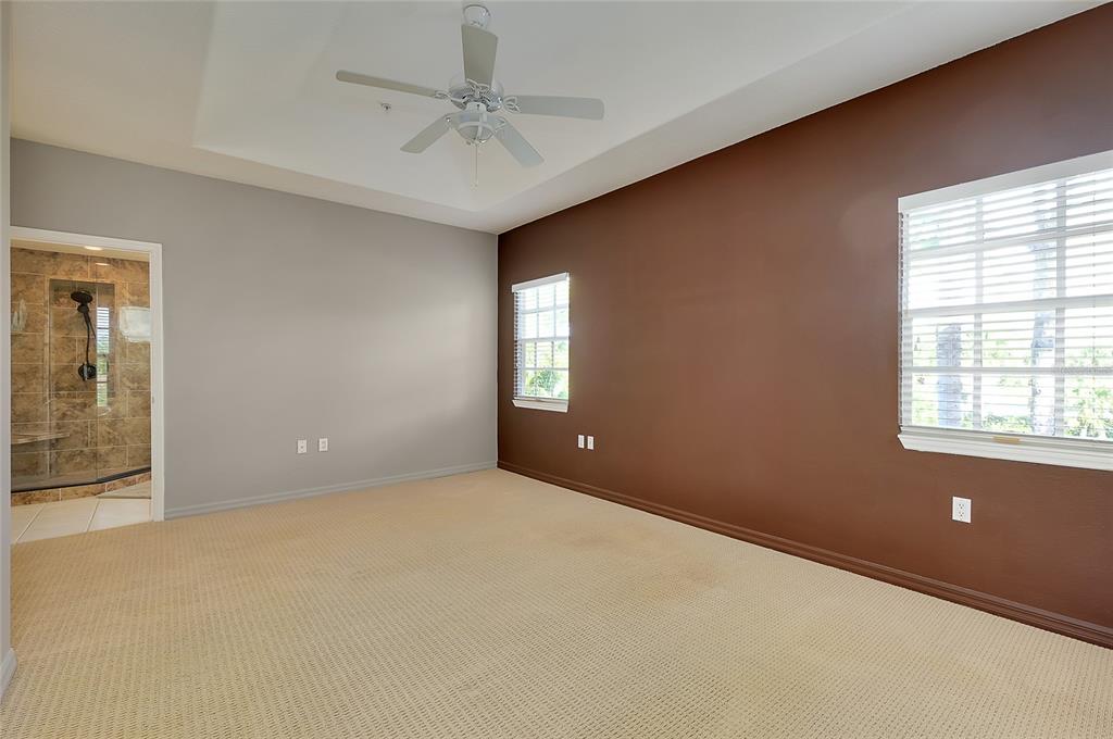 3975 Square E Lane, Unit 9 Sarasota, FL 34238 - Photo 26 of 52 an empty room with windows and fan