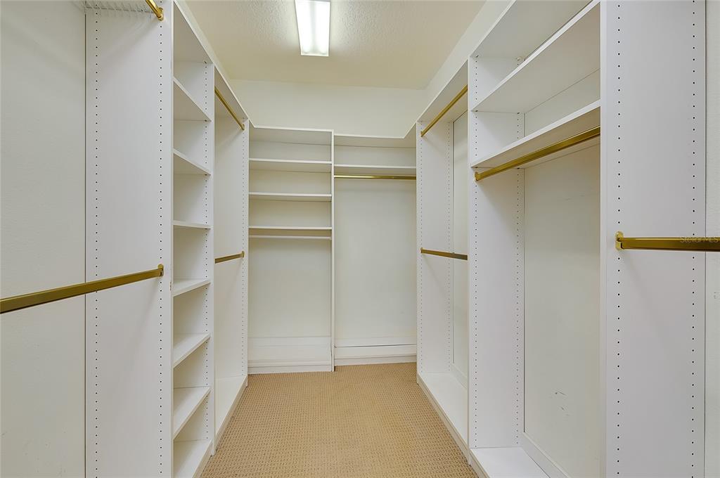 3975 Square E Lane, Unit 9 Sarasota, FL 34238 - Photo 33 of 52 a view of walk in closet with empty racks