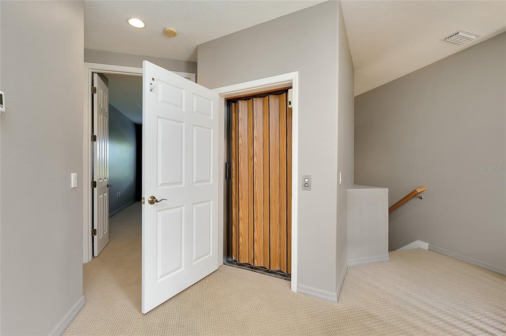 3975 Square E Lane, Unit 9 Sarasota, FL 34238 - Photo 44 of 52 wooden floor and closet in a room