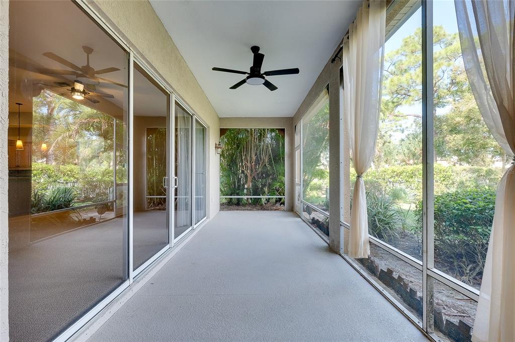 3975 Square E Lane, Unit 9 Sarasota, FL 34238 - Photo 49 of 52 a view of a porch with a floor to ceiling windows