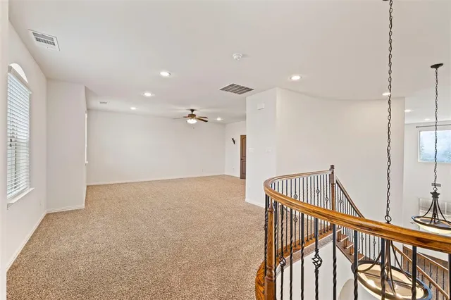 a view of a hallway with a chandelier