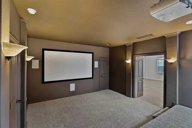 an empty room with closet and a ceiling fan