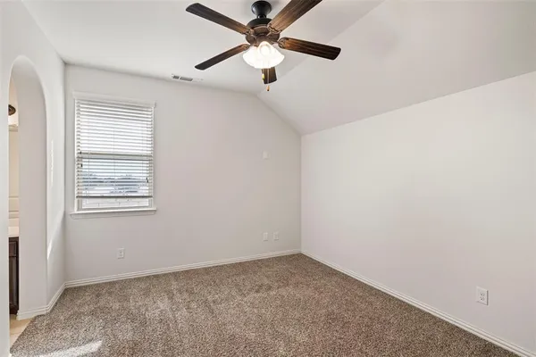 a view of a livingroom with a ceiling fan a ceiling fan and wooden floor