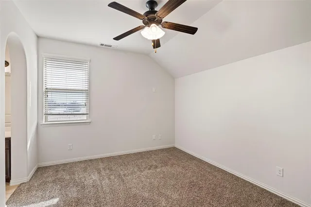 a view of a livingroom with a ceiling fan a ceiling fan and wooden floor