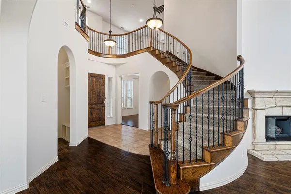a view of entryway and hall with wooden floor