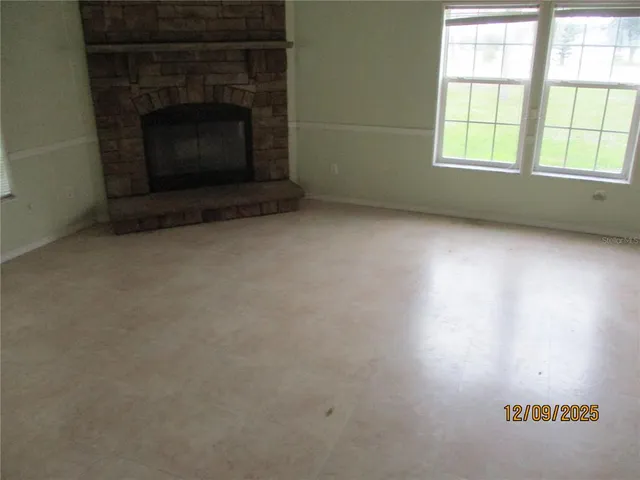an empty room with a fireplace