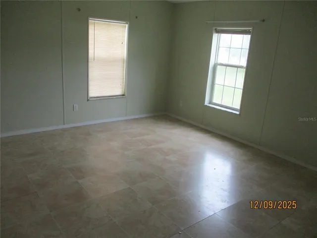 an empty room with windows