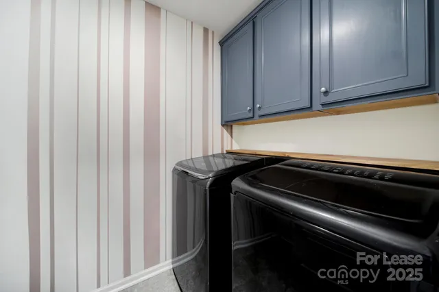 a spacious bedroom with a bed and a window