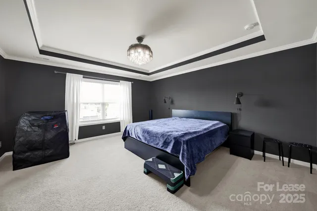 a bedroom with a bed and a night stand