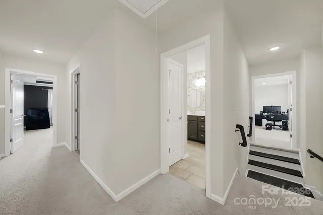 a living room with furniture and flat screen tv