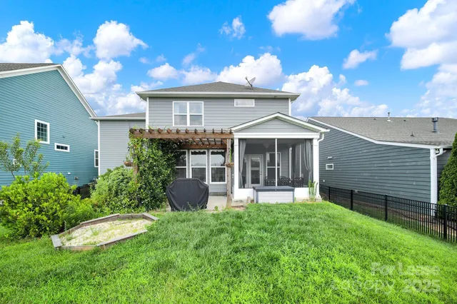 a view of a porch with furniture and yard