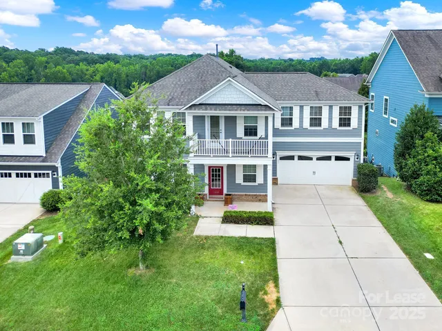 an aerial view of a house with a garden