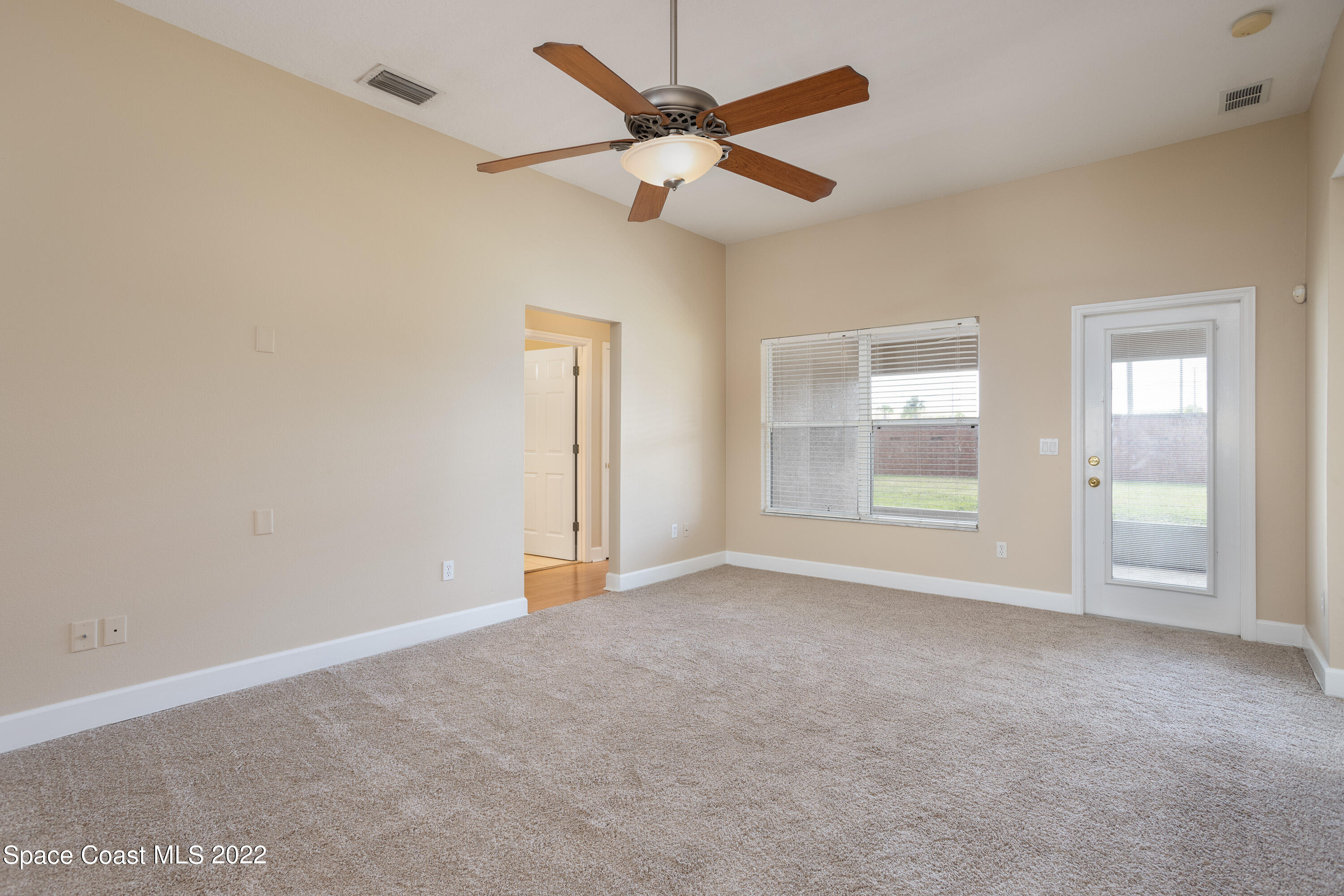 2400 Bridgeport Circle Rockledge, FL 32955 - Photo 11 of 31 an empty room with windows and fan