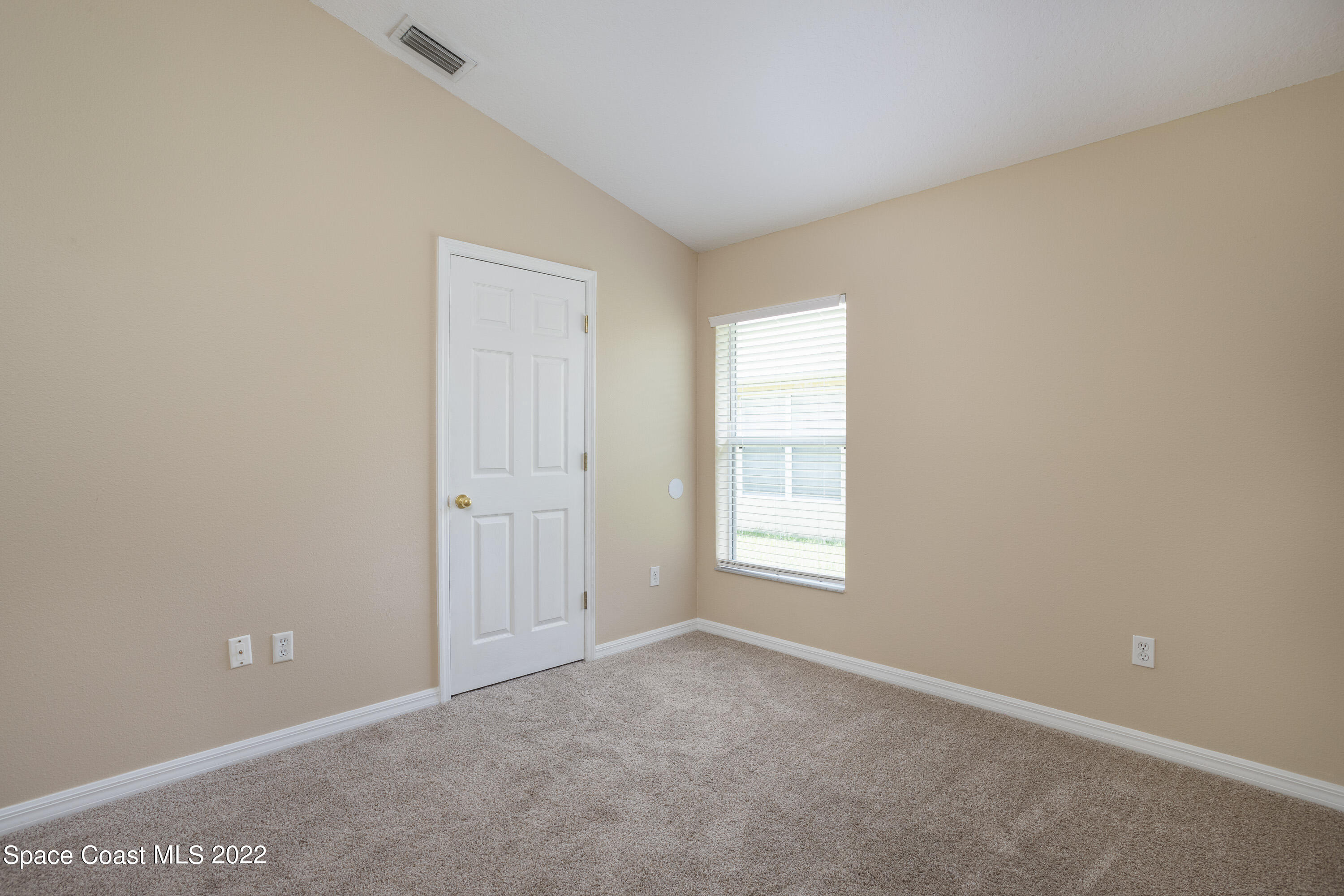 2400 Bridgeport Circle Rockledge, FL 32955 - Photo 22 of 31 an empty room with windows