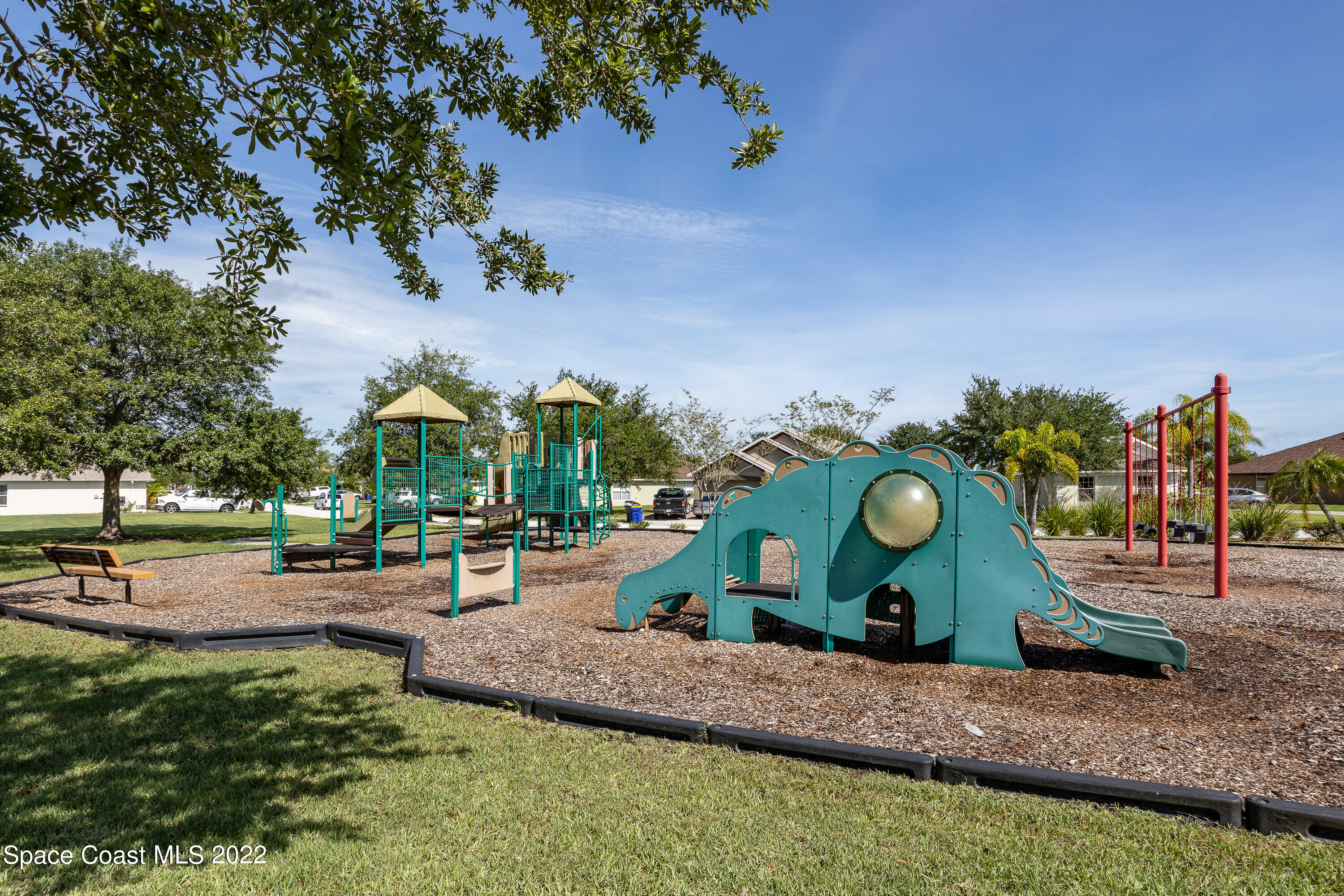 2400 Bridgeport Circle Rockledge, FL 32955 - Photo 28 of 31 an aerial view of a house with a swimming pool patio and outdoor seating