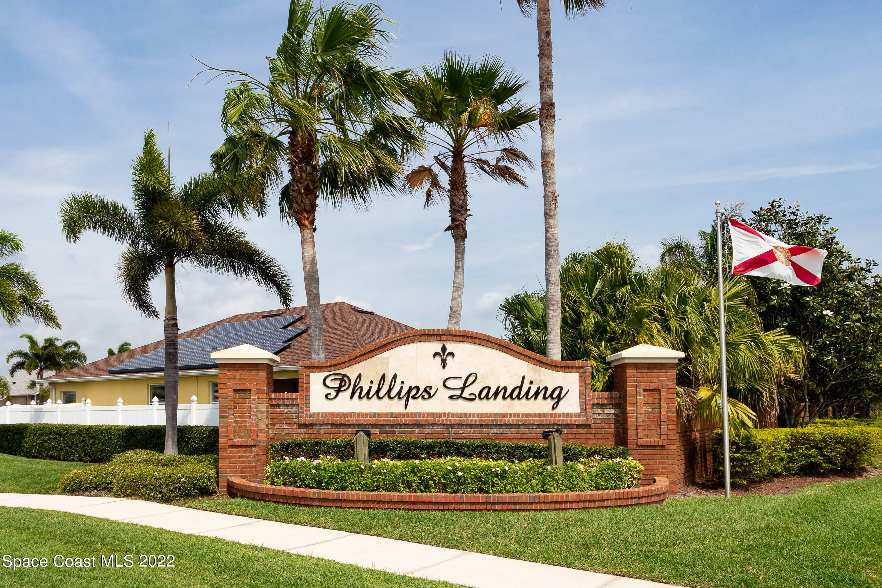 2400 Bridgeport Circle Rockledge, FL 32955 - Photo 30 of 31 a sign that is sitting in front of a house with a big yard