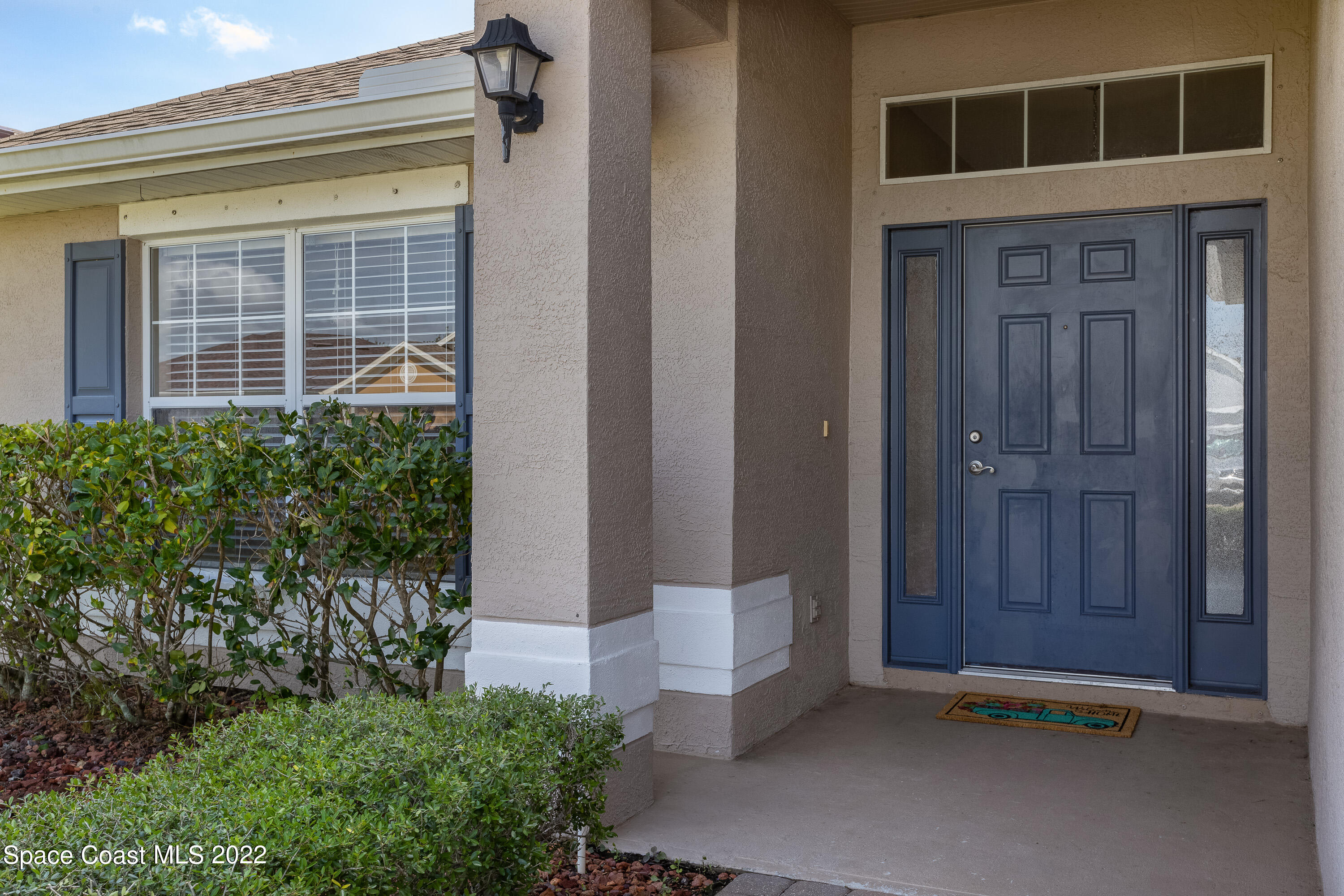 2400 Bridgeport Circle Rockledge, FL 32955 - Photo 4 of 31 a front view of a house with a yard