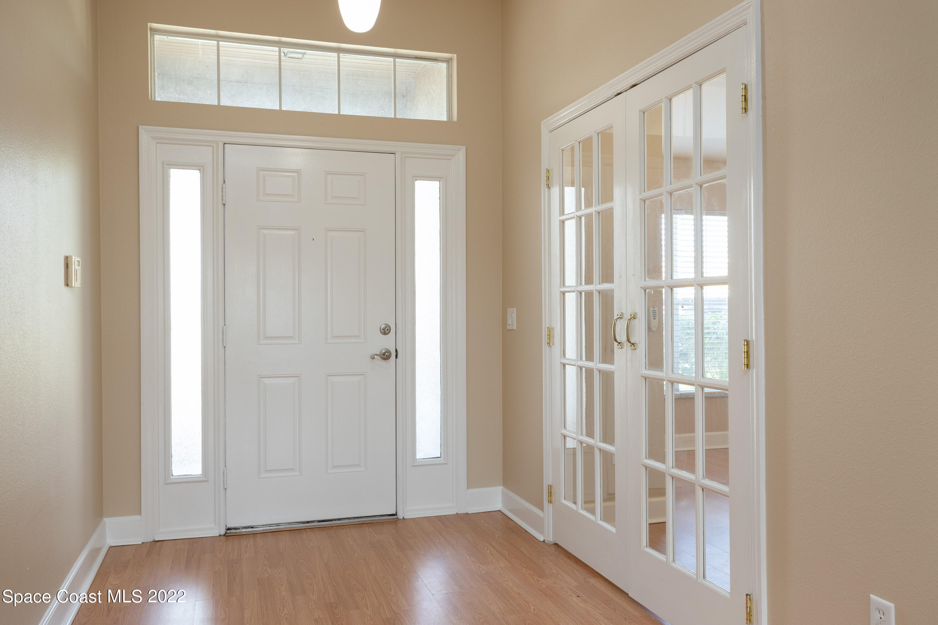 2400 Bridgeport Circle Rockledge, FL 32955 - Photo 5 of 31 a view of an entryway with wooden floor