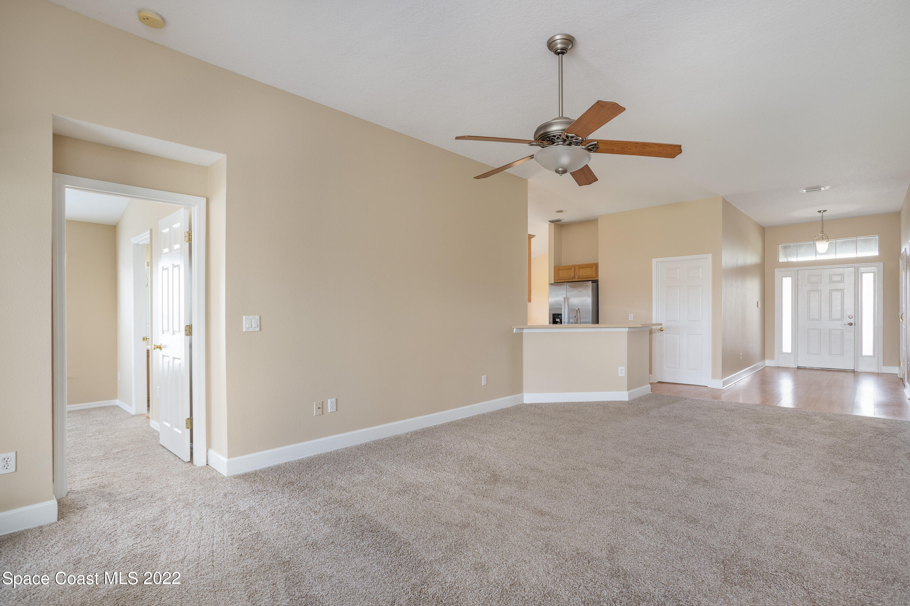 2400 Bridgeport Circle Rockledge, FL 32955 - Photo 10 of 31 a view of a kitchen with cabinet and a ceiling fan