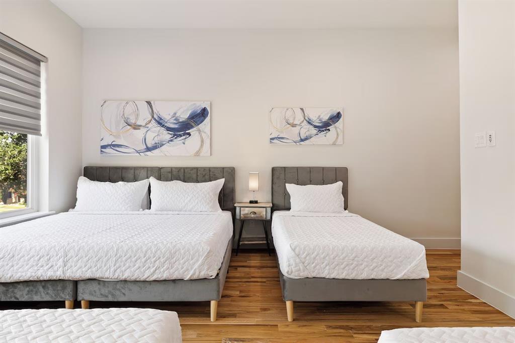 5942 Prospect Avenue Dallas, TX 75206 - Photo 17 of 25 Bedroom featuring wood finished floors and baseboards