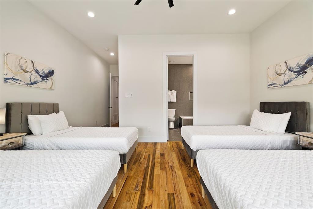 5942 Prospect Avenue Dallas, TX 75206 - Photo 18 of 25 Bedroom with recessed lighting, wood finished floors, ceiling fan, and connected bathroom