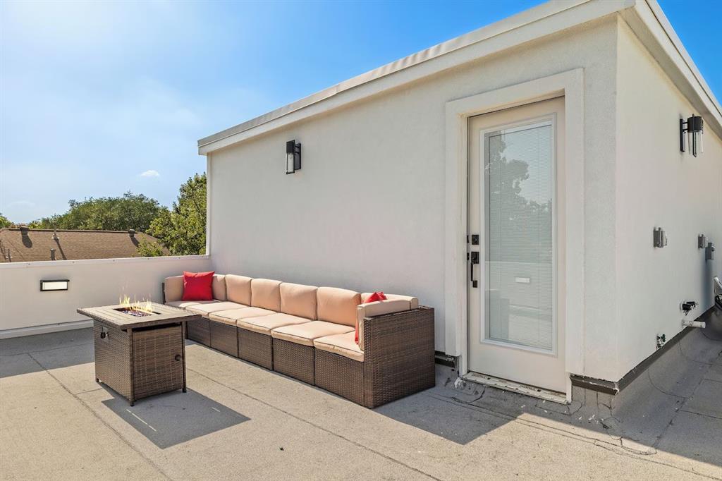 5942 Prospect Avenue Dallas, TX 75206 - Photo 25 of 25 View of patio / terrace with an outdoor living space with a fire pit