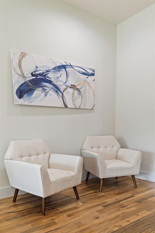 5942 Prospect Avenue Dallas, TX 75206 - Photo 10 of 25 Living area featuring wood finished floors