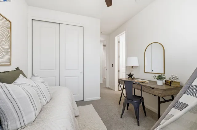 a bedroom with a bed and a table