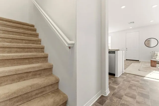 a view of entryway and hall with a rug