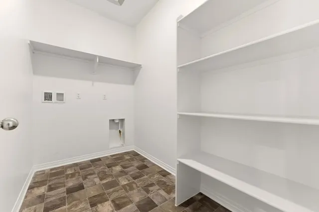a room with a cabinets and wooden floor