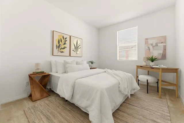 a bedroom with a bed and a table