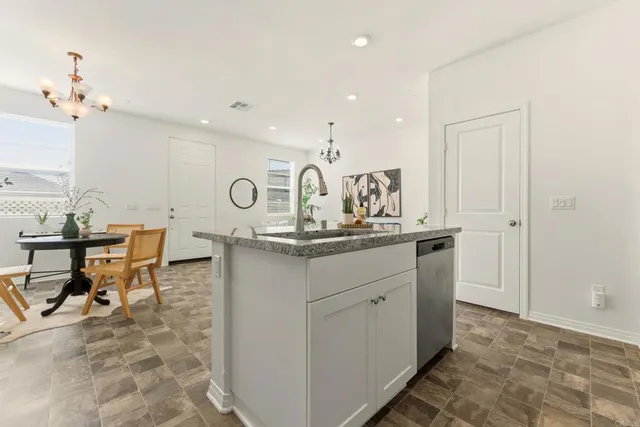 a very nice looking dining room with a table and chairs
