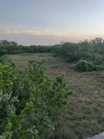 a view of a lake with a big yard