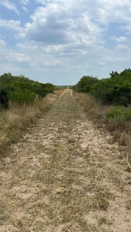a view of a lake with houses in the back