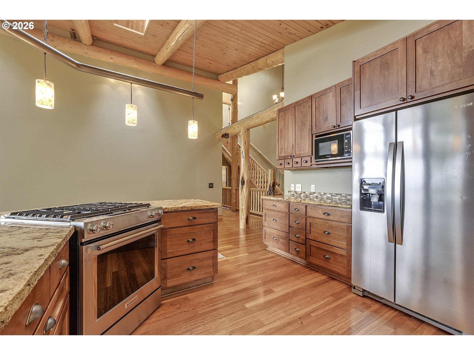 16860 Hoffman Avenue Sandy, OR 97055 - Photo 11 of 47 a kitchen with stainless steel appliances granite countertop a refrigerator a stove and a sink