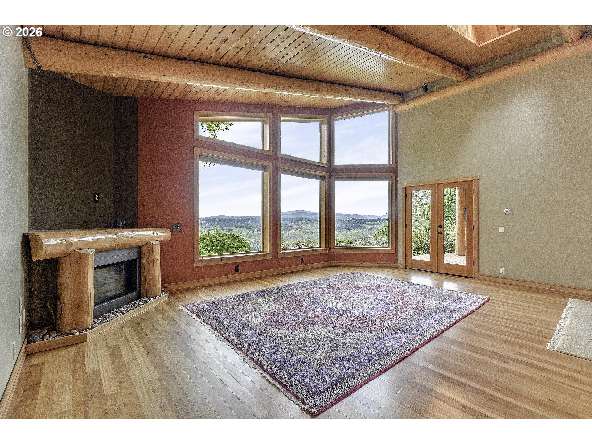 16860 Hoffman Avenue Sandy, OR 97055 - Photo 15 of 47 a view of an empty room with a fireplace and a window