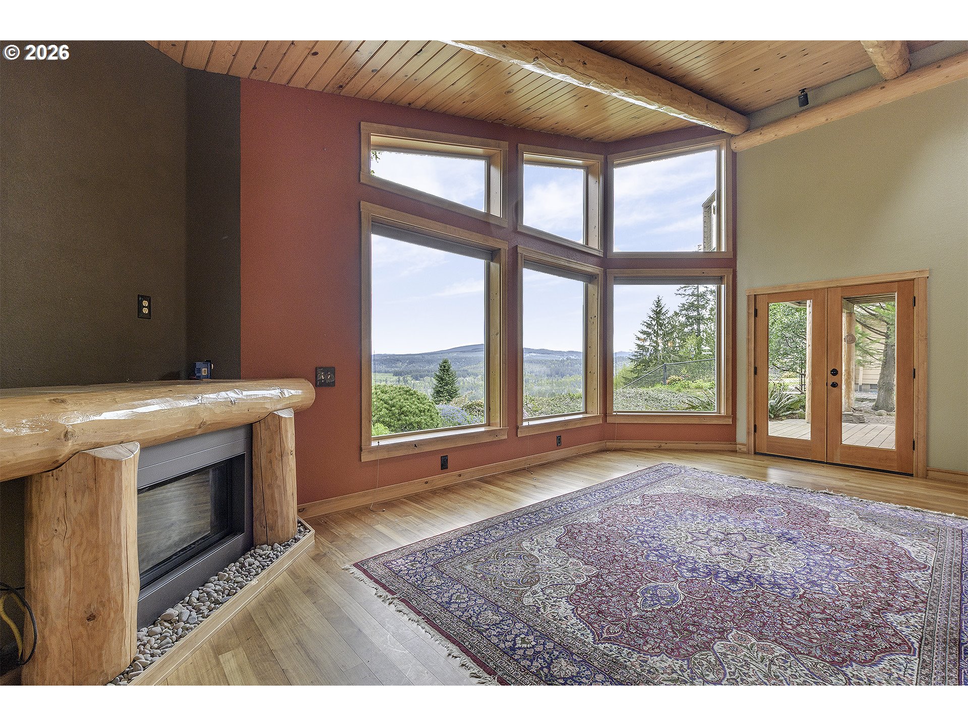 16860 Hoffman Avenue Sandy, OR 97055 - Photo 17 of 47 a view of an empty room with a fireplace and a window