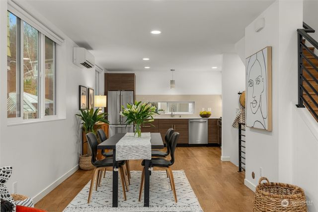 a view of a dining room with furniture window and wooden floor