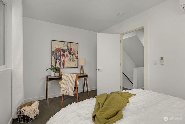 a bedroom with a bed and a cabinets