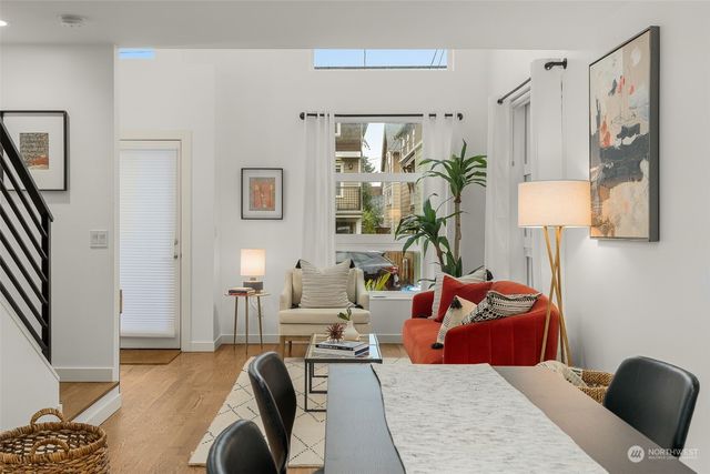 a living room with furniture lamp and rug